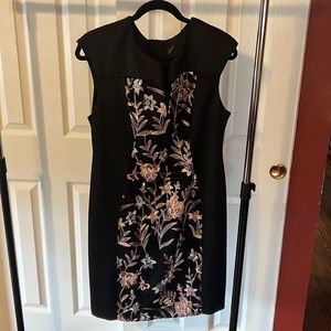 Connected apparel black dress with detailed embroidered stitched flowers. Size L